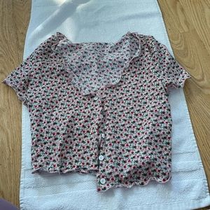 Pink blouse with red rose